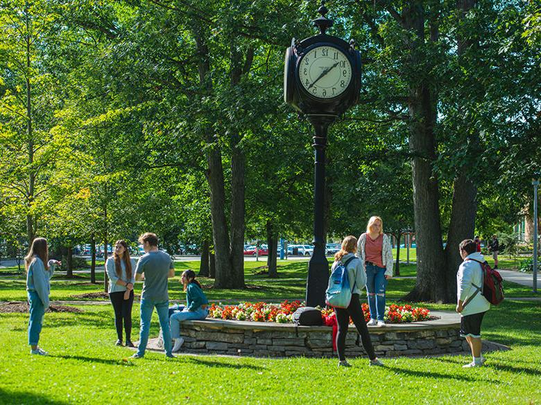 Students hanging out around the railroad clock